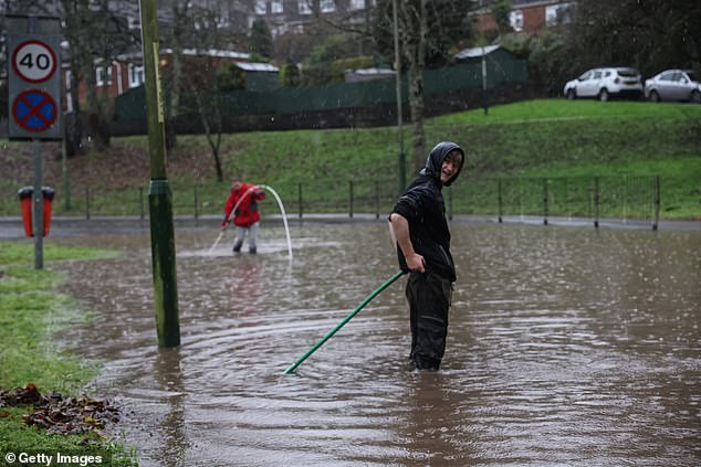 Residents are trying to clear the drains so the water can recede in Abercarn, Newport