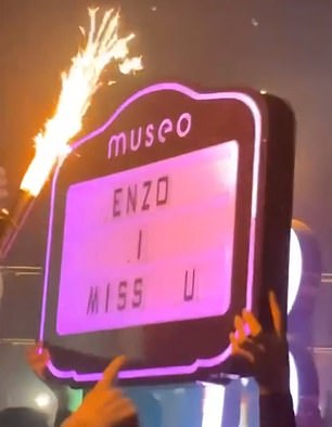 The sign reads 'Enzo I miss you'