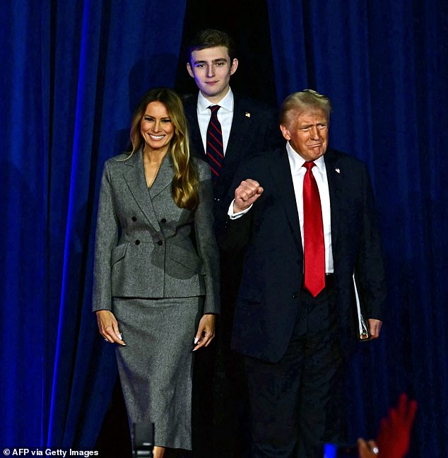 It has been reported that Barron is 6 feet tall and his father does his best to avoid being snapped too close to him to avoid unflattering comparisons. Pictured: President Donald Trump arrives for an election night event with his wife Melania and son Barron