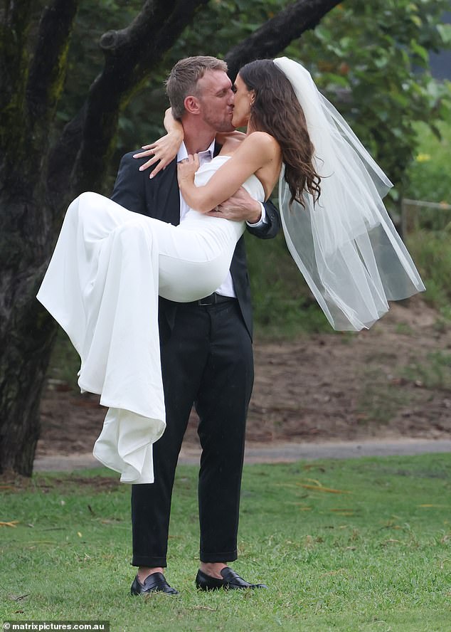 The blushing bride, who shares son Jack, two, with Luke, was all smiles on her big day as she shared a passionate kiss with her new husband