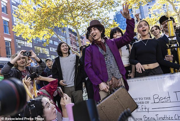 Miles Mitchell, a senior at Staten Island University, was ultimately crowned the winner, tossing candy from a briefcase while dressed in a purple Willy Wonka outfit after his win