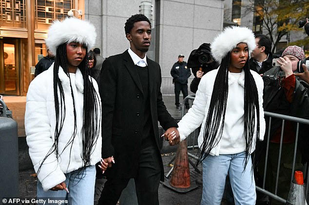 Diddy blew kisses to the girls and several other family members who came to support him at the New York City courthouse; pictured with brother King Combs (center)