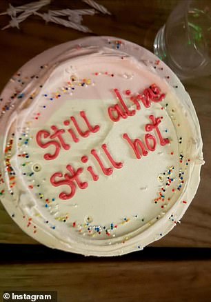 One photo showed her cake, which read: 'Still alive, still hot'