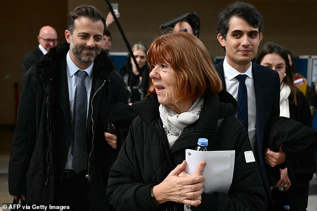 Gisele Pelicot (C) leaves the Avignon courthouse with her lawyers Antoine Camus (L) and Stephane Babonneau (R) during the trial, on November 20