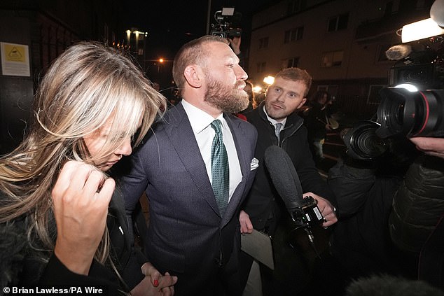 Conor McGregor and partner Dee Devlin leave the High Court in Dublin after the verdict