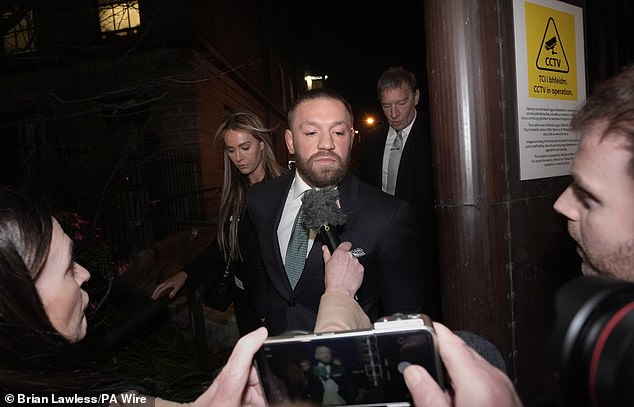 Conor McGregor and partner Dee Devlin leave the High Court in Dublin on Friday afternoon