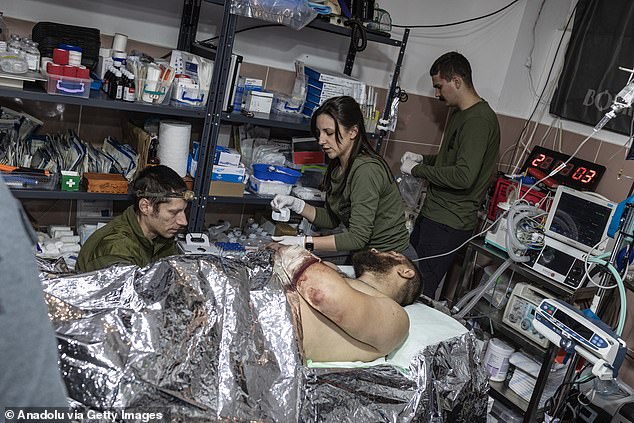 Ukrainian medics from the ULF medic group treat Ukrainian soldiers injured during a battle, in the direction of Pokrovsk