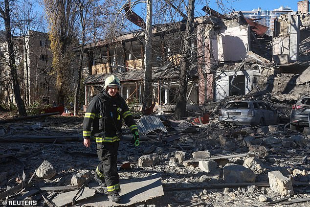 A rescuer walks in front of a building hit by a Russian missile attack, amid the Russian attack on Ukraine, in Odesa, Ukraine, November 25, 2024