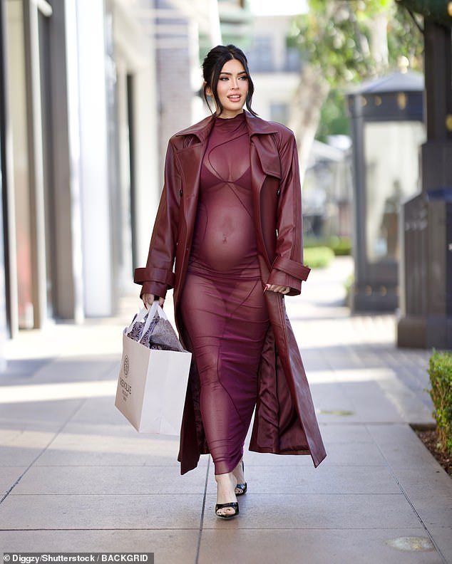 The actress, 38, who announced earlier this month she was expecting her first child with partner Machine Gun Kelly, 34, showed off her blossoming baby bump and her lingerie as she made a glamorous appearance at The Grove