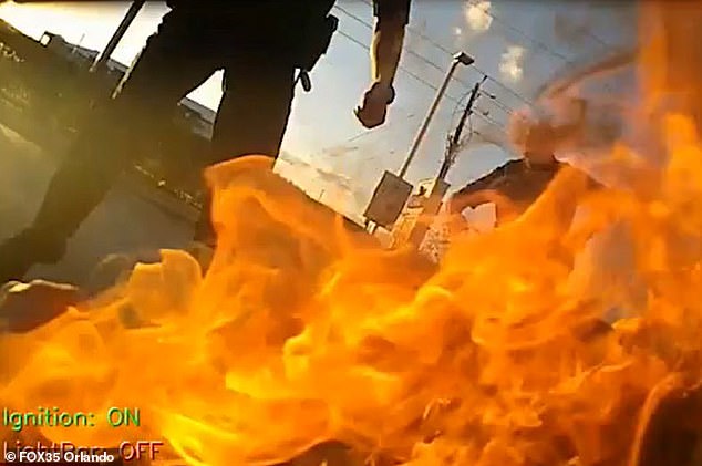 Crawford was charged with tasing a motorcyclist while pumping gas during a botched arrest, leaving them both on fire. Pictured: Flames from the explosion