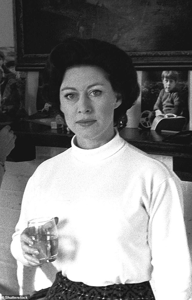 Princess Margaret has a drink in the drawing room of Robin Douglas-Home's country house in West Chiltington in West Sussex in 1967