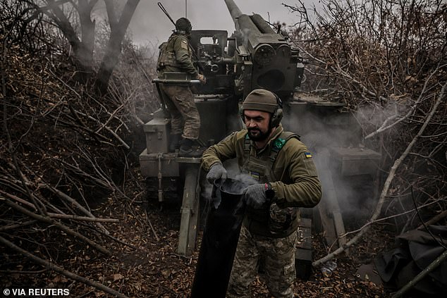 Ukrainian soldiers fire a 2s5 "Hyacinth-s" self-propelled howitzer towards Russian troops on the front line, near Khasiv Yar on November 18