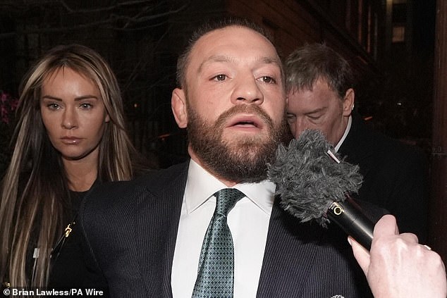 Mixed martial arts fighter Conor McGregor and partner Dee Devlin leave the High Court in Dublin following the personal injury case against him