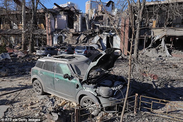 This photo taken on November 25, 2024 shows destroyed cars next to a destroyed building after a rocket attack in Odesa