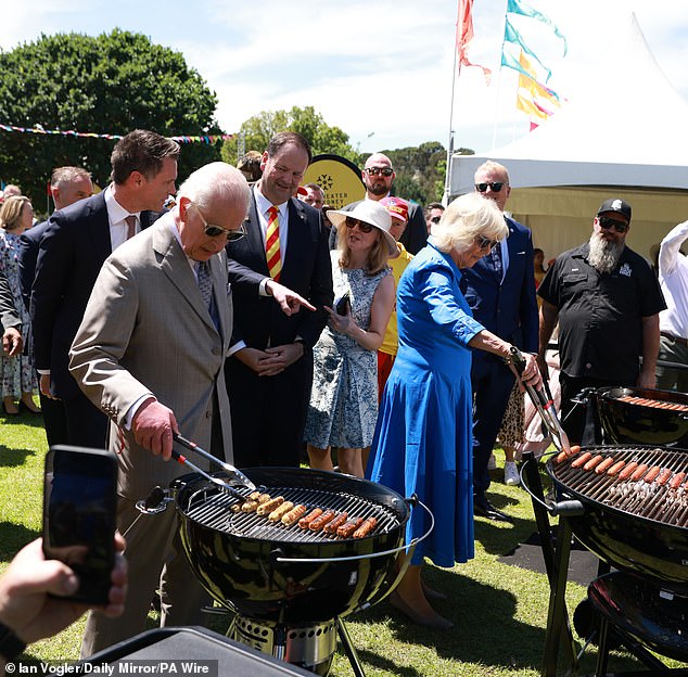 King Charles is now considering cutting back on red meat following his treatment for an unspecified form of cancer. Pictured: King Charles and Queen Camilla help cook sausages during a community barbecue at Parramatta Park in Sydney, October 22, 2024