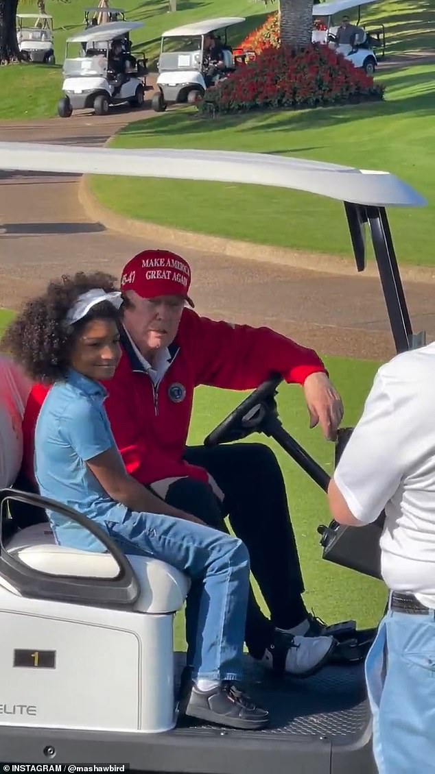 The young girl then jumps into Trump's golf cart to take a photo with the newly elected president