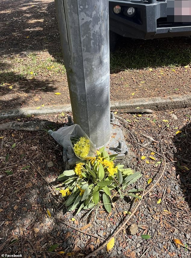 Mourners left floral tributes at the spot where the car was parked