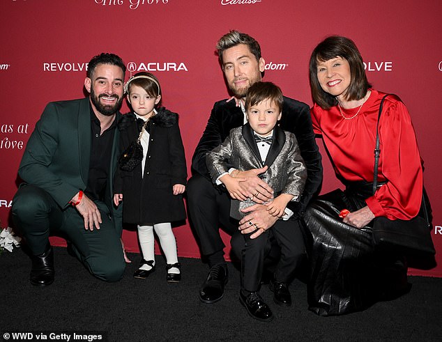 He turned the event into a family affair when he showed up with husband Michael Turchin, their three-year-old twins Violet and Alexander, and mother Diane Bass.