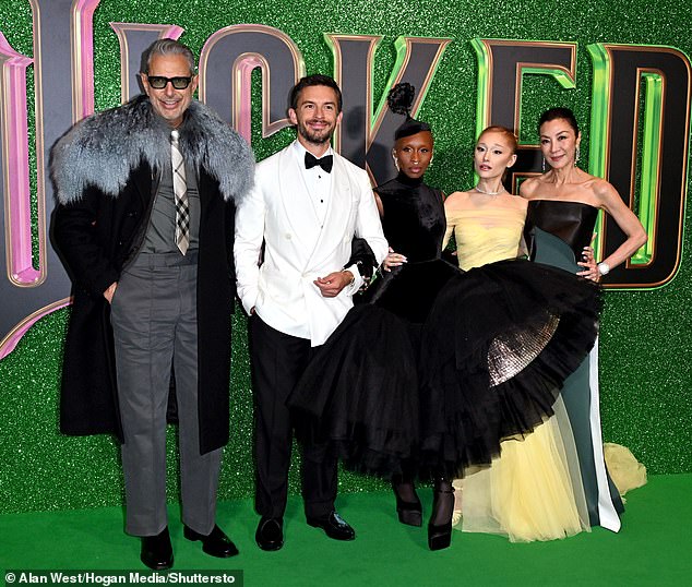 Meanwhile, Michelle Yeoh and Jeff Goldblum, who play Madame Morrible and the Wizard respectively, each earn $2 million; pictured from left to right: Jeff, Jonathan Bailey, Cynthia, Ariana and Michelle in London