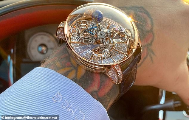 McGregor wears a $1.3 million Jacob & Co Astronomia Tourbillon Baguette watch, with 342 invisible-set baguette-cut diamonds on the dial and 80 diamonds on the lugs