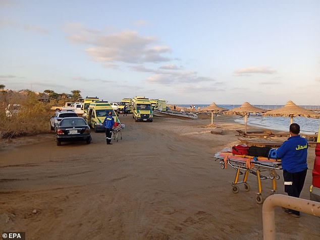 Medics wait for possible survivors after a boat sank in a port in Marsa Alam, Red Sea Governorate, Egypt, November 25, 2024