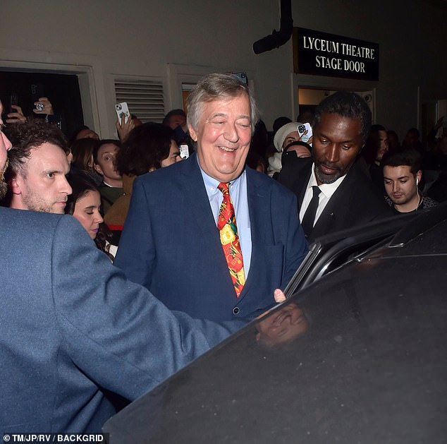 Stephen Fry was also spotted leaving the theater and appeared in cheerful mood as he greeted fans at the stage door