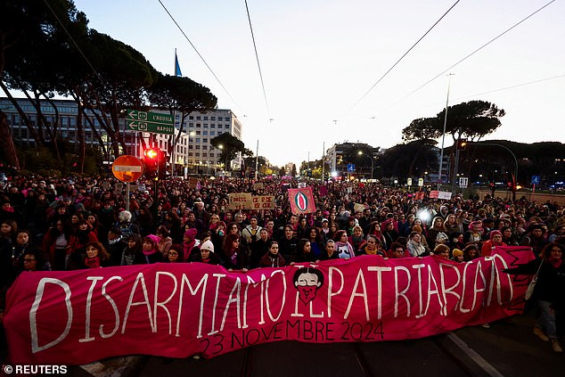 Women hold a banner as people from the Non Una di Meno (Not One Less) movement and feminist collectives take part in a protest ahead of the International Day for the Elimination of Violence against Women, in Rome, Italy, November 23, 2024