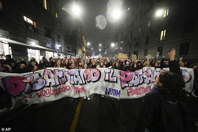 Women attend a gathering to mark the International Day for the Elimination of Violence against Women, in Milan, Italy, Monday, November 25, 2024