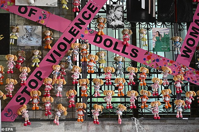 The installation 'Wall of Dolls', commemorating the victims of gender-based violence, is displayed on the facade of the Palace of the Liguria region on the occasion of the International Day for the Elimination of Violence against Women in Genoa, Italy, November 25 2024