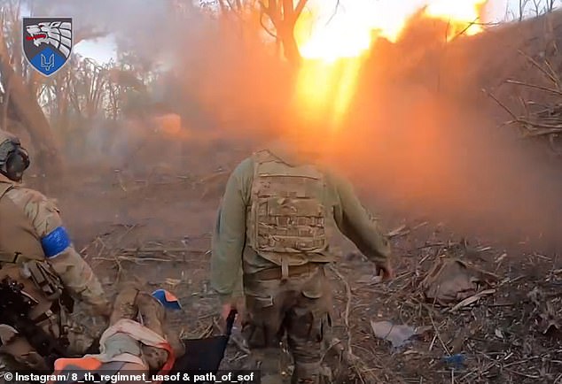 The soldiers walked through rubble and litter while being targeted by Russian artillery