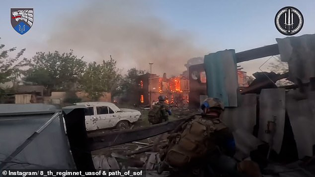 Buildings and cars were crushed and destroyed in the clip posted by the 8th Special Operations Forces Regiment