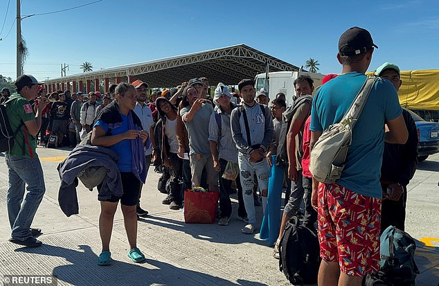 Migrants lined up in Tehuantepec, Mexico, for buses to other parts of the country after taking part in caravans. They received help from the Mexican National Migration Institute