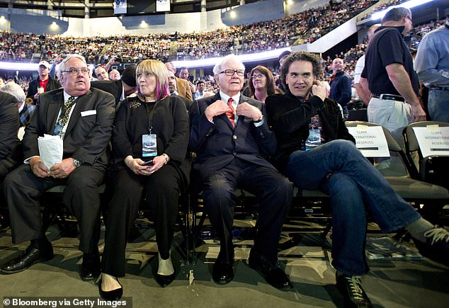 This comes after the 94-year-old billionaire announced why he won't leave his vast fortune to his children (pictured with Buffett), but will instead give away 99 percent of the money he made through his company Berkshire Hathaway.