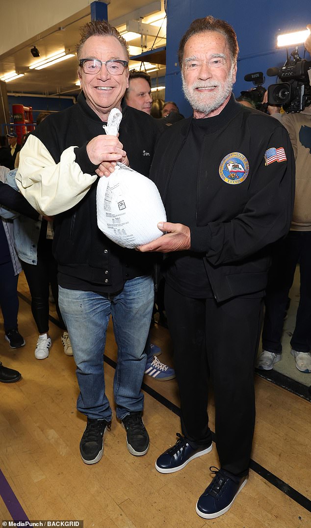 He was joined by 65-year-old actor and comedian Tom Arnold at the youth center, and the two posed for snapshots together