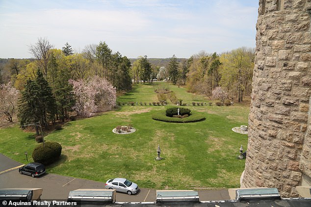 The beautiful castle was once surrounded by lush gardens and ample outdoor space, but the ornate property is now sandwiched between other residential buildings