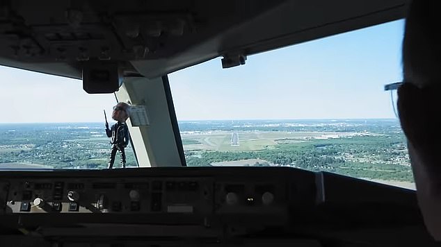 The cockpit dashboard features the Trumpinator bobblehead, showing the President-elect wearing an outfit inspired by the movie 'The Terminator'