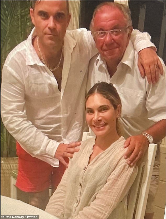 In 2020, Robbie revealed that his father Pete had been diagnosed with Parkinson's disease, admitting at the time that he was battling 'anxiety and panic' over his father's diagnosis (Pete pictured with Robbie and his wife Ayda)