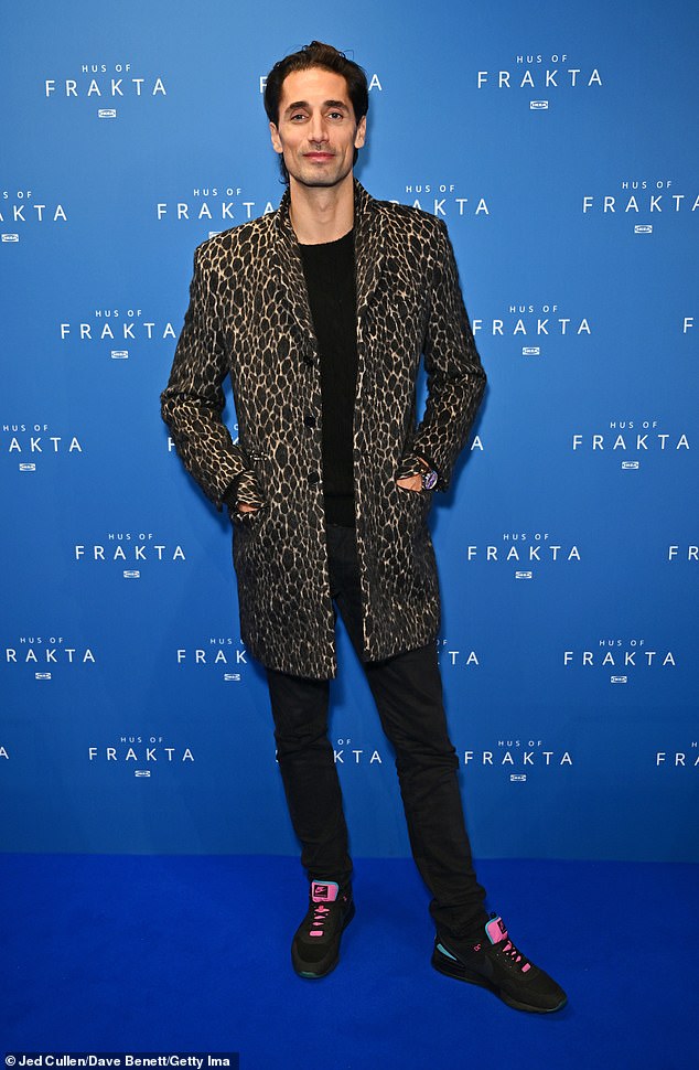 TV personality Hugo Taylor, 38, also stepped out in animal print as he posed for a photo in a leopard print trench coat which he paired with black and pink trainers