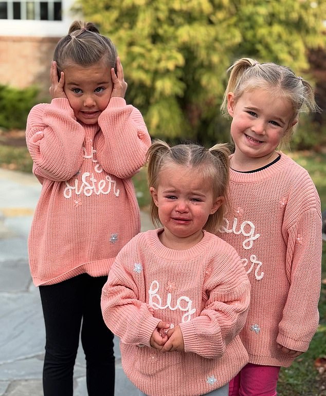 The couple revealed the news with this post, which shows their three daughters: Wyatt (left), Elliotte (right) and Bennett (center) wearing sweaters all with 