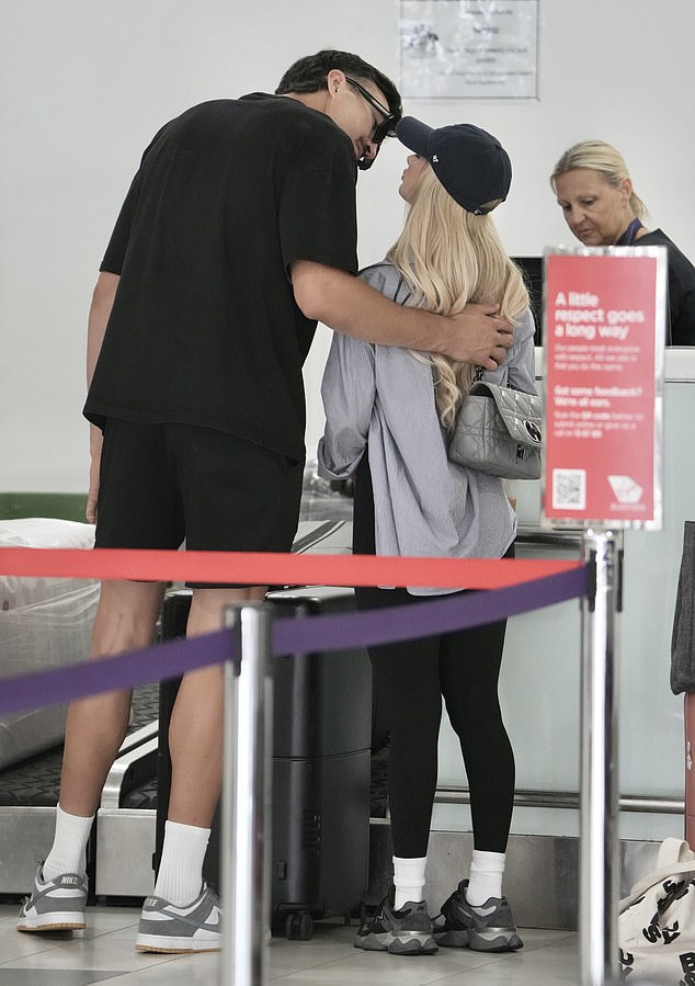 Ivan was seen lovingly kissing Chelsea as they packed on the PDA as they checked in for their flight