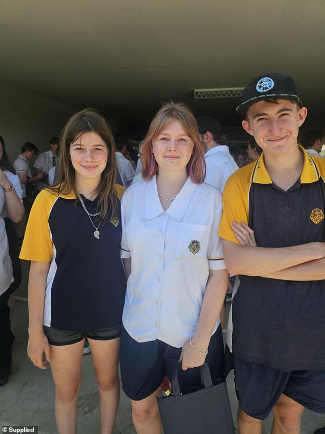 Beau is pictured next to his sisters