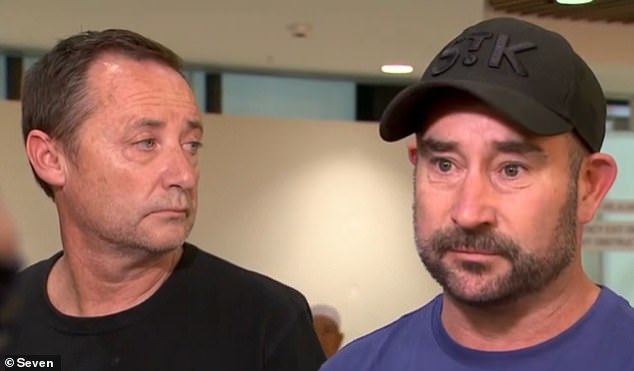 The two girls' fathers Shaun Bowles (left) and Mark Jones (right) at Melbourne airport after bringing their daughters' bodies home