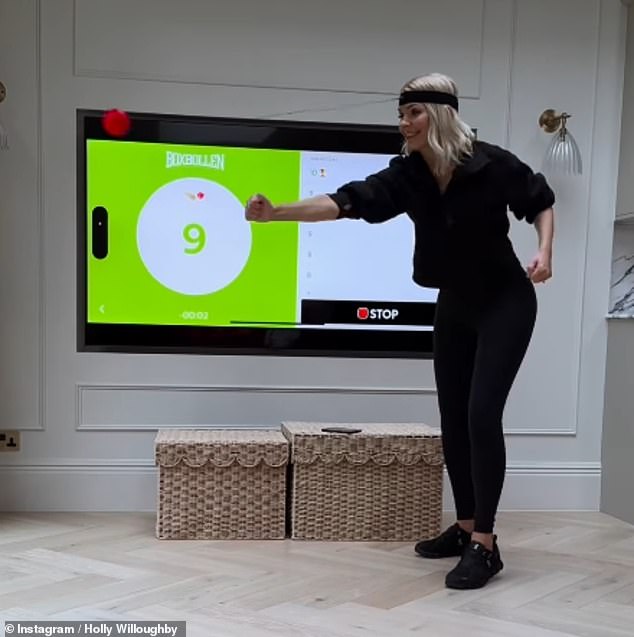 Holly left fans in hysterics on Tuesday with a hilarious social media clip as she played with a family member in a lavish show home - after moving out of her £3million family home