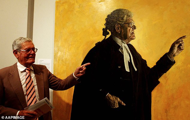 NSW Chief Justice Andrew Bell described Hughes (pictured with his portrait in 2004) as 'one of the finest trial lawyers and advocates in the history of our country'