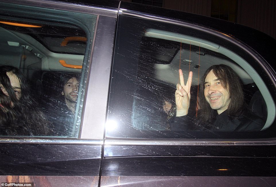 Bobby flashed a peace sign as he left the bash in the back of a taxi