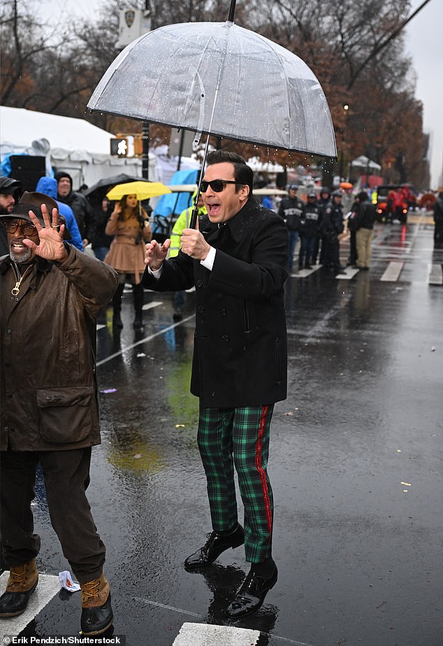 The Tonight Show star had viewers in stitches as he wore black sunglasses despite standing under an umbrella in the pouring rain