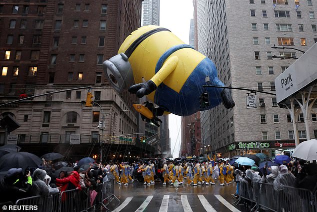 The Stuart the Minion balloon flies through the streets of Manhattan