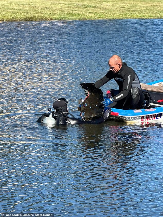 Divers from Sunshine State Sonar retrieve pieces of the car from the depths of the pond