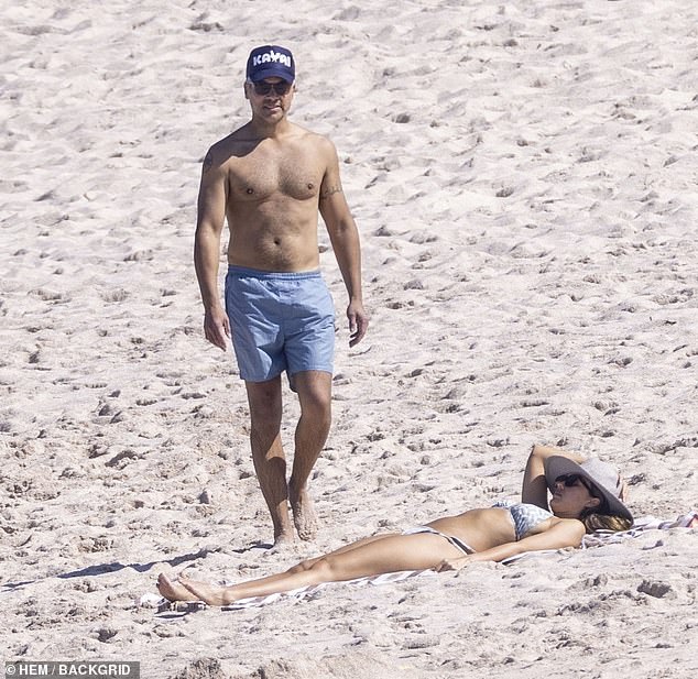 Husband Cash Warren, 45, showed off his hot body in a pair of swim trunks as the family enjoyed their time together