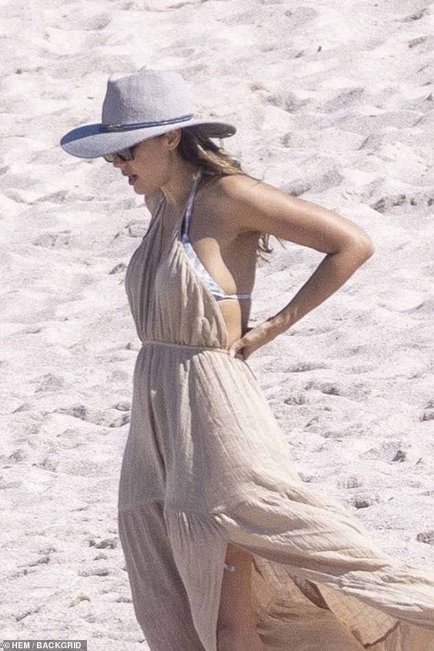 Jess wore a stylish summer dress as she relaxed on the beach